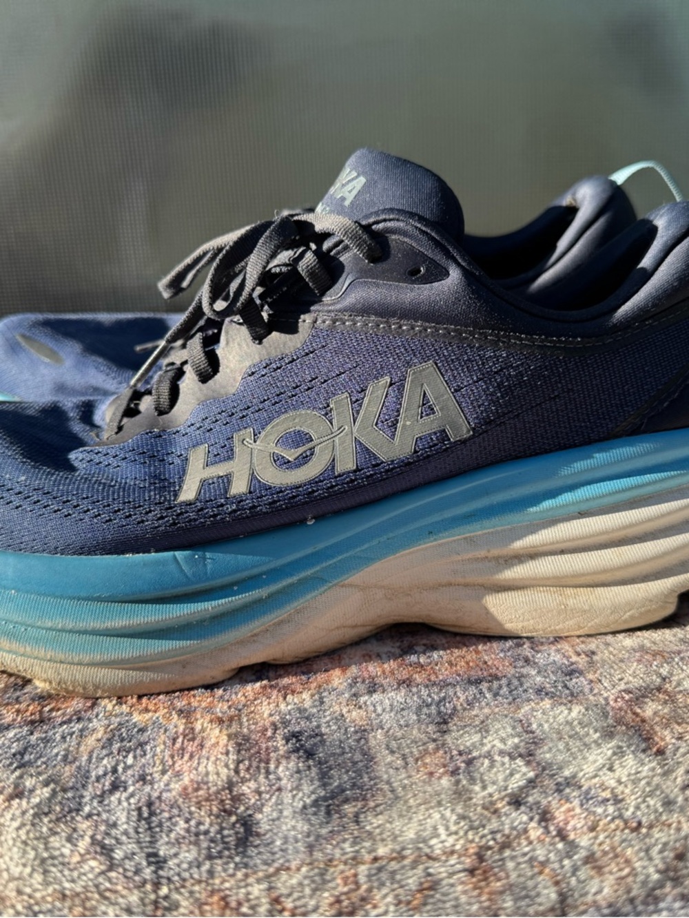 Hoka navy blue and light blue running sneakers